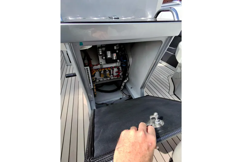 Slide: The Image of Electrical panel inside a 2017 Monte Carlo 420 yacht, showcasing wiring and components. - 35