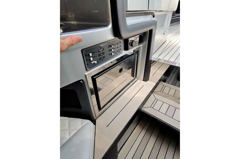 Slide: The Image of Interior view of a 2017 Monte Carlo 420 yacht, featuring control panel and sleek flooring. - 37