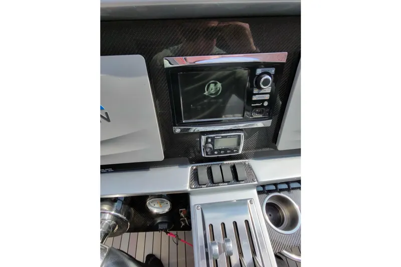 Slide: The Image of Control panel of a 2017 Monte Carlo 420 boat with navigation equipment. - 40