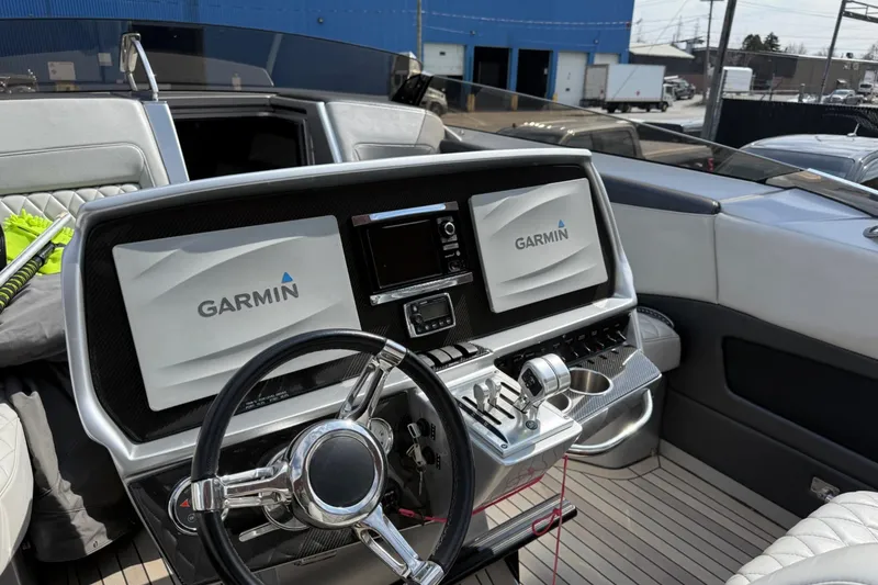 Slide: The Image of Cockpit of 2017 Monte Carlo 420 yacht with Garmin navigation system and luxurious seating. - 45