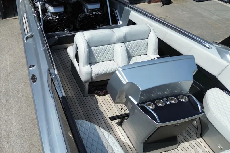 Slide: The Image of Luxurious interior of a 2017 Monte Carlo 420 boat with plush seating and sleek controls. - 5