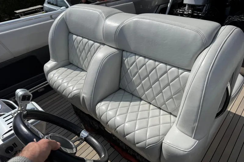 Slide: The Image of Luxurious leather seating in a 2017 Monte Carlo 420 boat cockpit. - 50