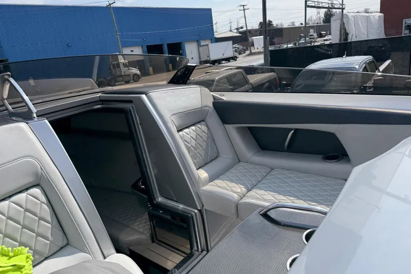 Slide: The Image of Luxurious interior of a 2017 Monte Carlo 420 boat with quilted seating. - 52