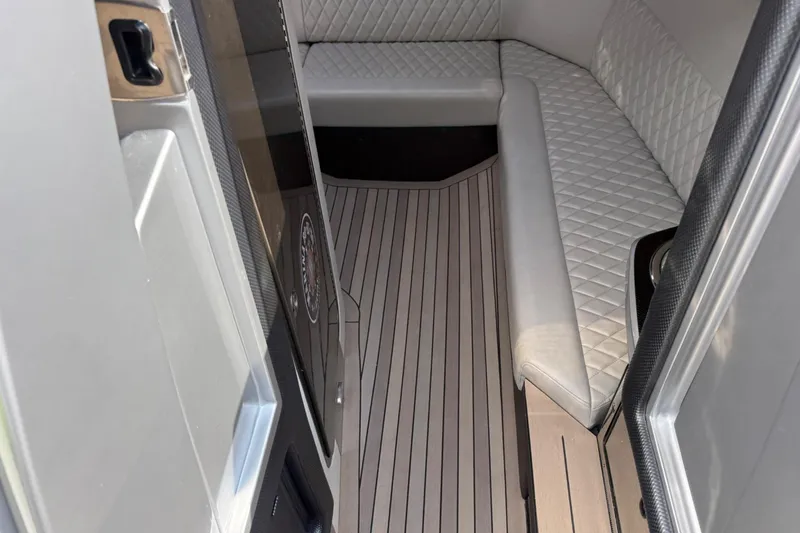 Slide: The Image of Luxurious interior of a 2017 Monte Carlo 420 yacht with quilted seating and sleek flooring. - 57