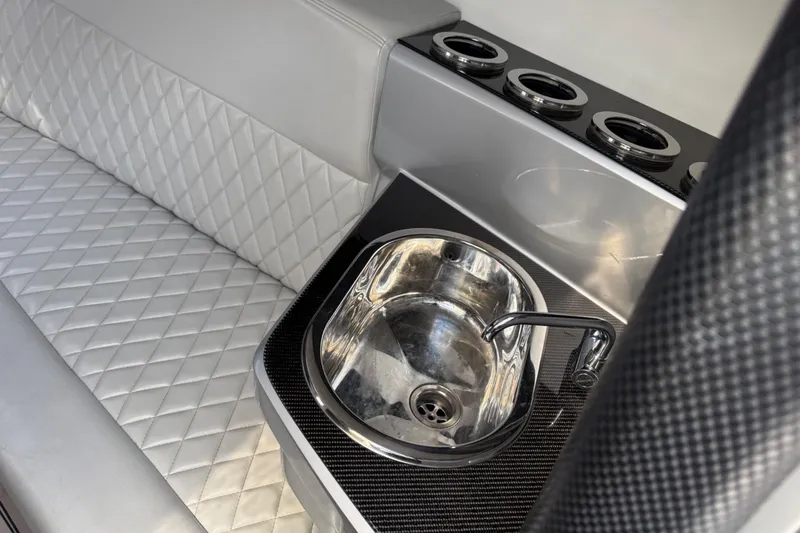 Slide: The Image of Luxurious Monte Carlo 420 yacht interior with quilted seating and sleek sink, 2017 model. - 58