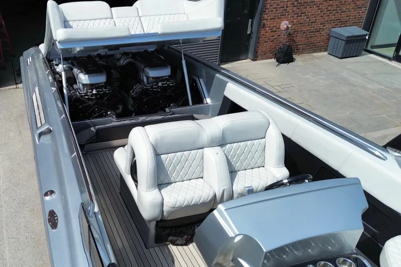 Slide: The Image of Luxury Monte Carlo 420 boat interior with plush seating and powerful engines, 2017 model. - 6