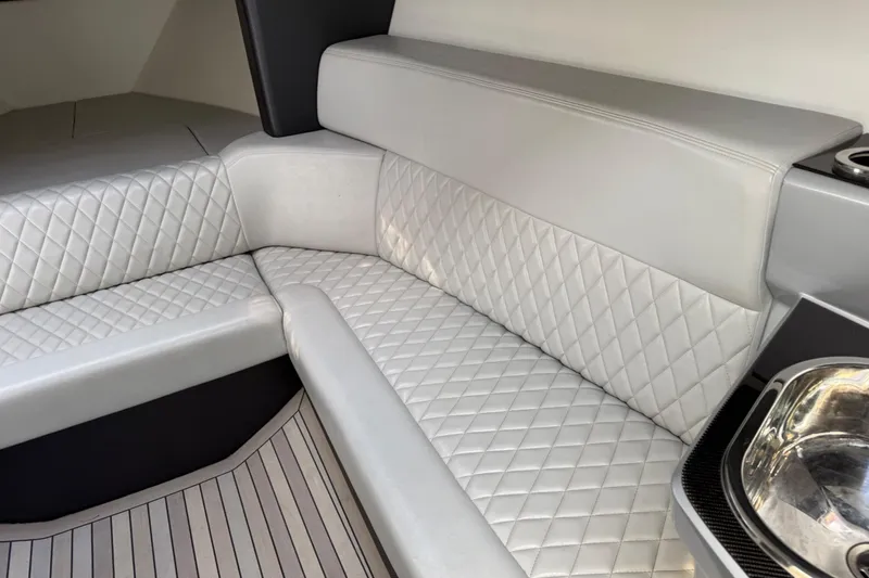Slide: The Image of Luxurious interior seating of a 2017 Monte Carlo 420 yacht with quilted upholstery. - 60