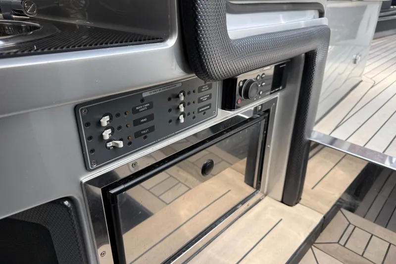 Slide: The Image of Control panel and equipment on a 2017 Monte Carlo 420 yacht interior. - 63