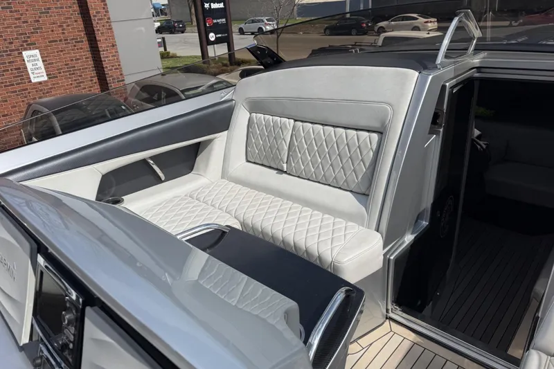 Slide: The Image of Luxurious seating on a 2017 Monte Carlo 420 yacht, featuring quilted upholstery. - 65