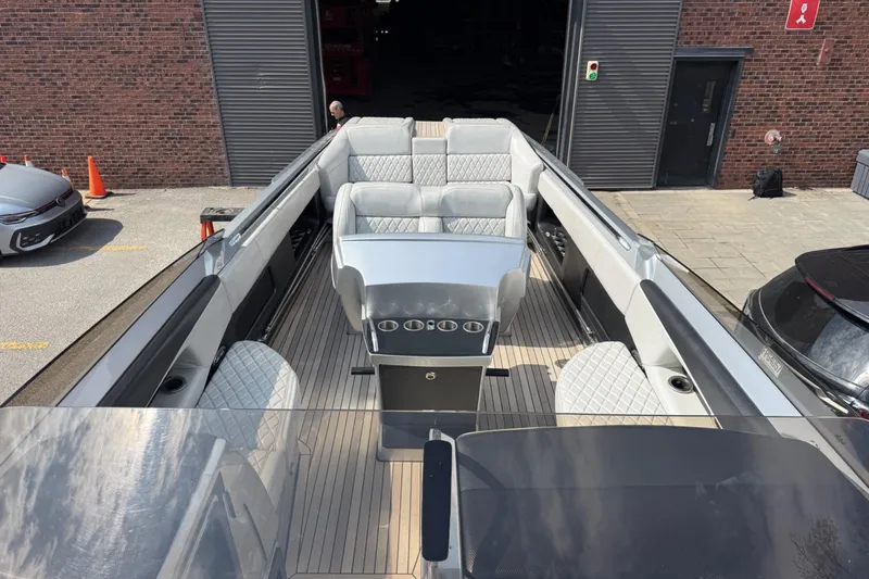 Slide: The Image of Luxury Monte Carlo 420 boat interior with sleek seating, docked near a brick building, 2017 model. - 71
