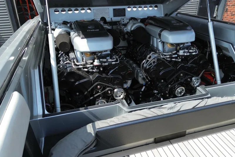 Slide: The Image of Twin engines in a 2017 Monte Carlo 420 boat, showcasing powerful marine engineering. - 8