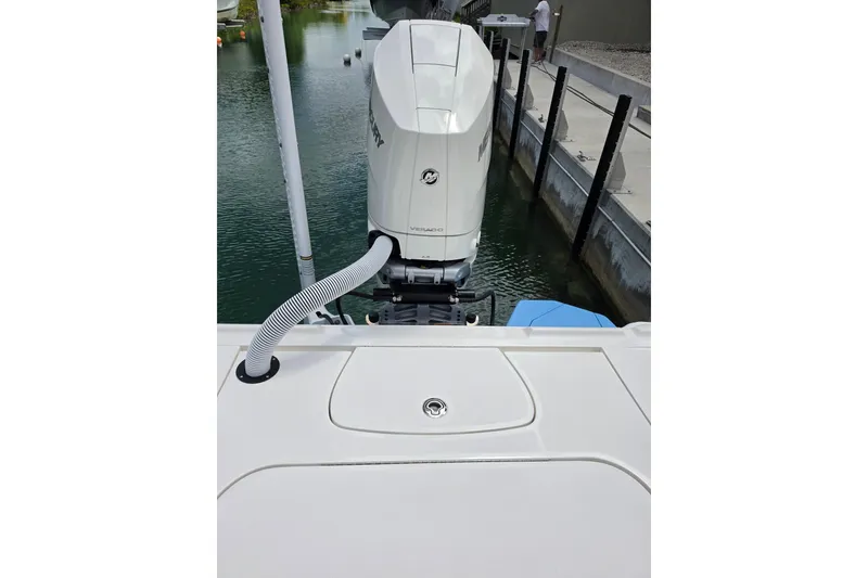 Slide: The Image of 2025 SeaVee 270Z boat with Mercury outboard engine, docked in a marina. - 11