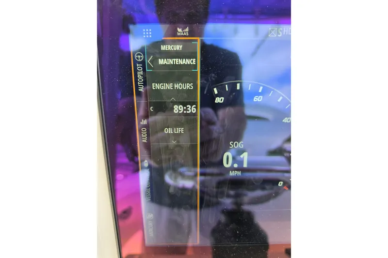 Slide: The Image of Dashboard display of 2025 SeaVee 270Z showing engine hours and speed. - 7