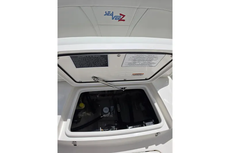Slide: The Image of Engine compartment of 2025 SeaVee 270Z boat, showcasing interior details and branding. - 9