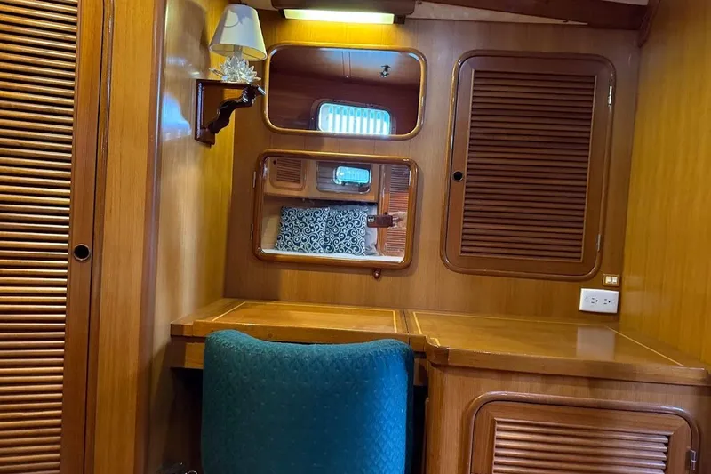 Slide: The Image of Cozy wooden cabin interior of 1997 Taswell 50 yacht with desk and mirror. - 21