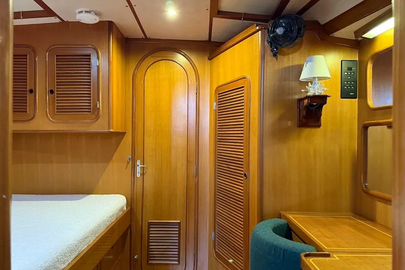Slide: The Image of Cozy 1997 Taswell 50 yacht cabin with wooden interior and built-in furniture. - 22