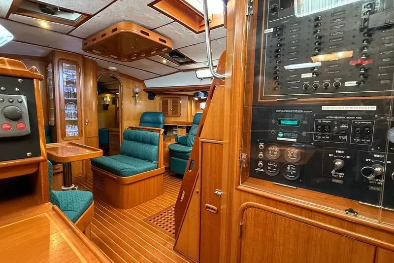 Slide: The Image of Luxurious 1997 Taswell 50 yacht interior with wood paneling and control panels. - 26
