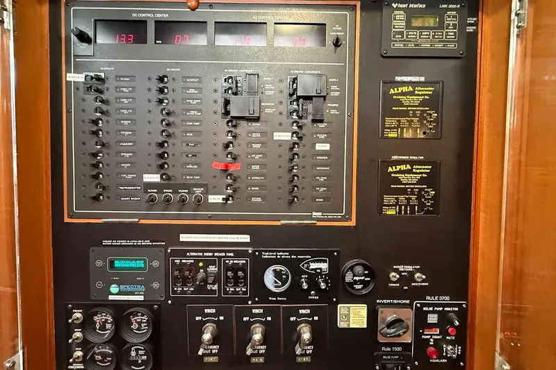 Slide: The Image of Electrical control panel on a 1997 Taswell 50 yacht, featuring various switches and gauges. - 30