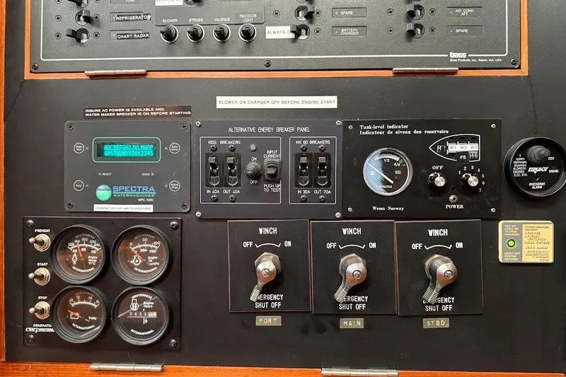 Slide: The Image of Control panel of a 1997 Taswell 50 yacht with gauges and switches. - 33
