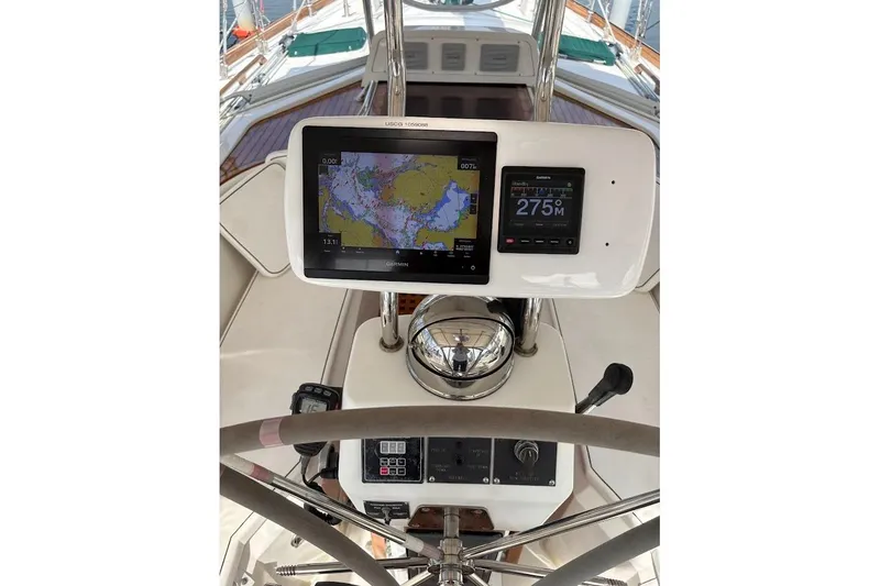 Slide: The Image of Cockpit of 1997 Taswell 50 sailboat with navigation equipment and steering wheel. - 34
