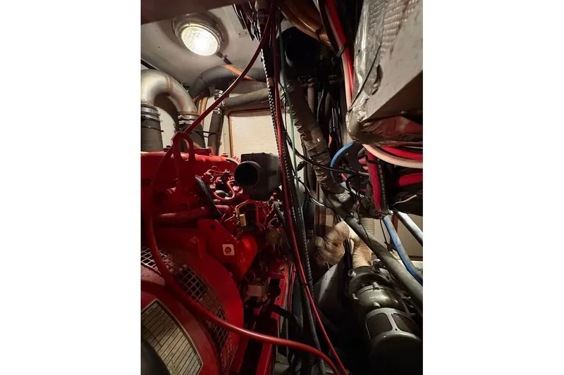 Slide: The Image of Engine room of a 1997 Taswell 50 yacht, featuring complex wiring and machinery. - 35