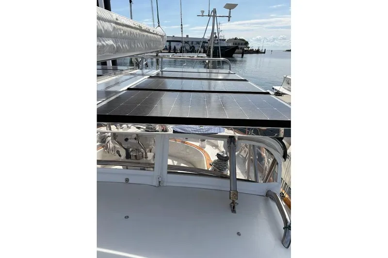 Slide: The Image of Sailboat deck with solar panels, Taswell 50, 1997 model, docked at marina. - 40