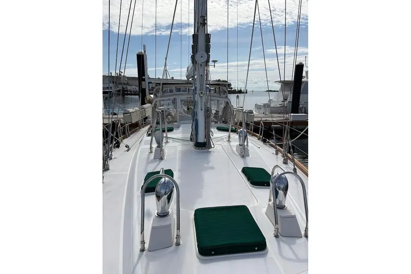 Slide: The Image of Deck view of 1997 Taswell 50 sailboat docked at marina under clear sky. - 41