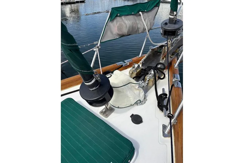 Slide: The Image of Deck view of a 1997 Taswell 50 sailboat with green accents and rigging. - 42