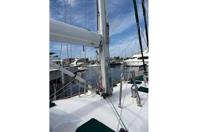 Slide: The Image of Deck view of a 1997 Taswell 50 sailboat docked in a marina. - 43
