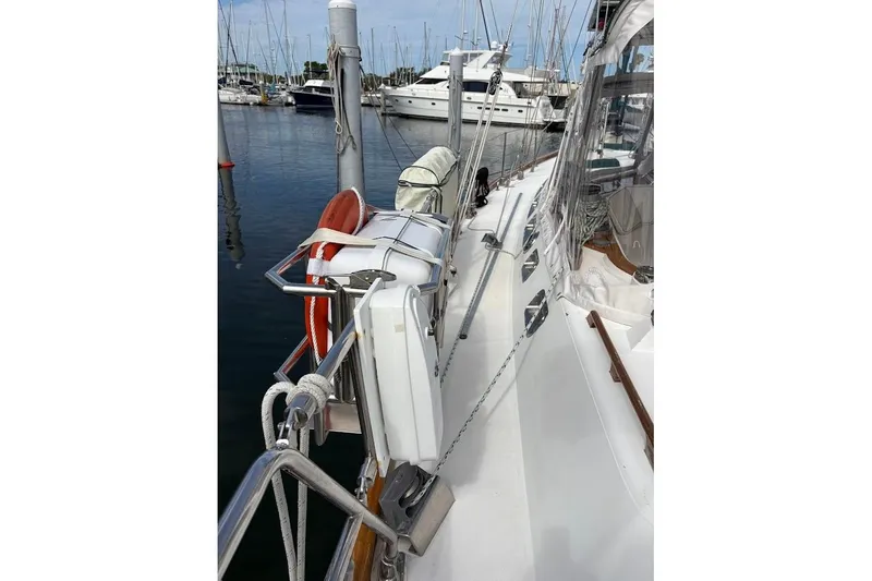 Slide: The Image of Deck view of a 1997 Taswell 50 yacht docked at a marina. - 45
