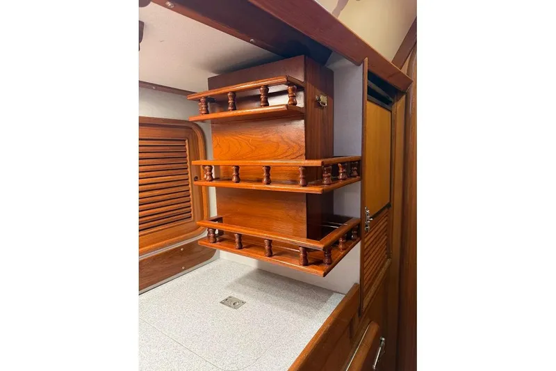 Slide: The Image of Wooden interior shelving in a 1997 Taswell 50 yacht cabin. - 9