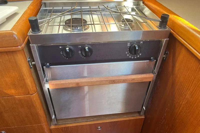 Slide: The Image of Stainless steel stove and oven in a 2002 Hunter 326 sailboat galley. - 13