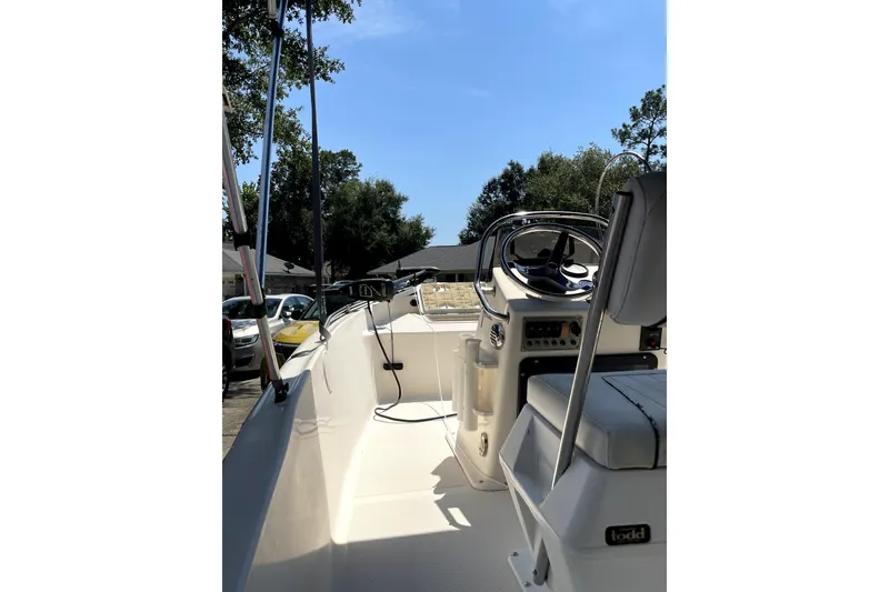 Slide: The Image of 2006 Key West 152 Center Console boat interior with steering wheel and seating. - 3