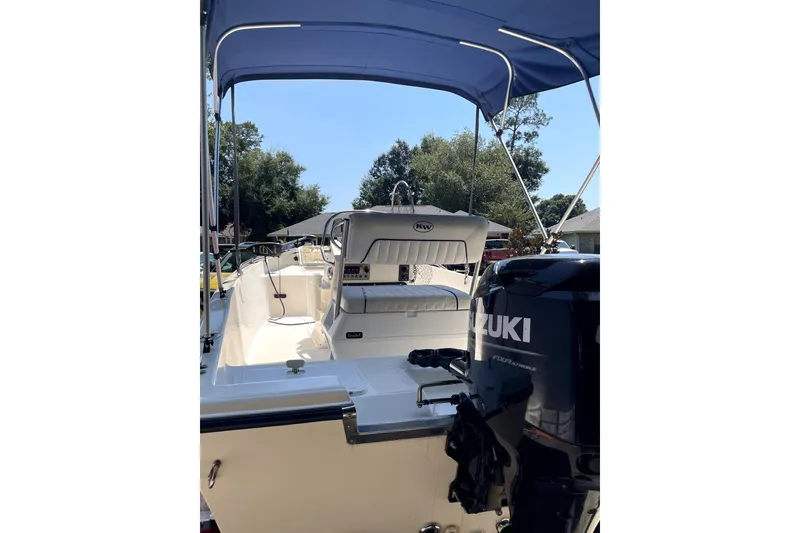 Slide: The Image of 2006 Key West 152 Center Console boat with Suzuki engine, under blue canopy. - 4