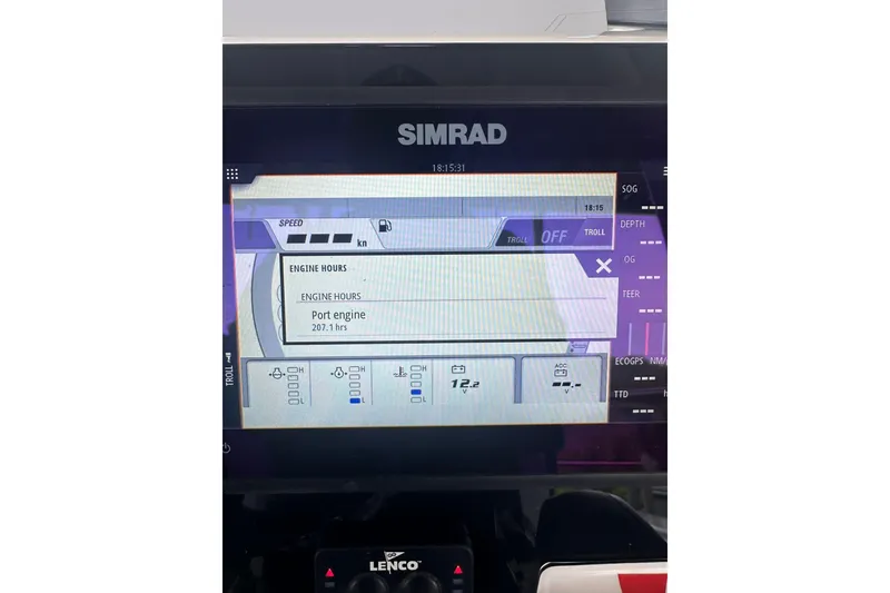 Slide: The Image of Simrad display showing engine hours on 2023 Robalo R222 Explorer boat. - 17