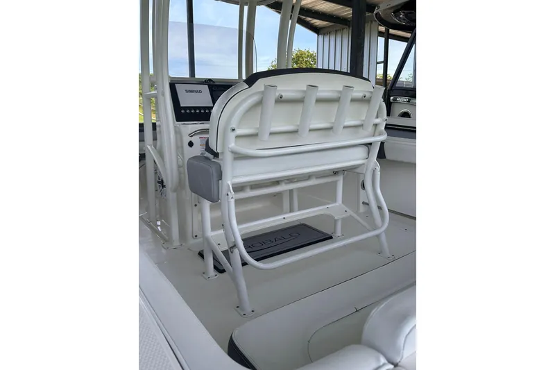 Slide: The Image of 2023 Robalo R222 Explorer boat interior with helm seating and control panel. - 6