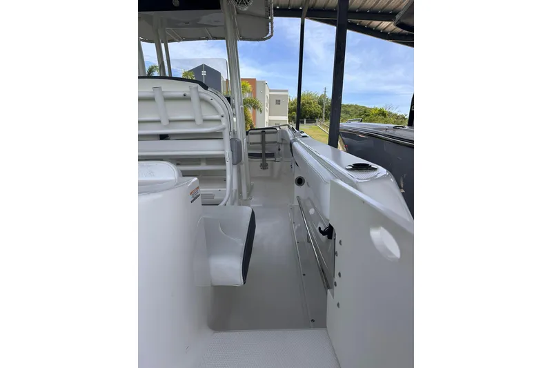Slide: The Image of 2023 Robalo R222 Explorer boat interior, showcasing sleek design and spacious seating. - 7