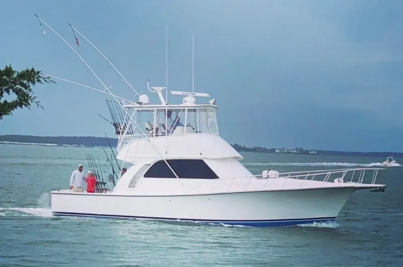 The Image of 2011 Henriques 42 Sportfisherman cruising on calm waters, perfect for fishing. - 0