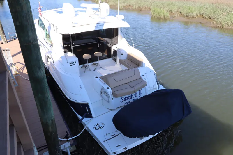 Slide: The Image of 2015 Cruisers Yachts 45 Cantius docked, luxurious design. - 2