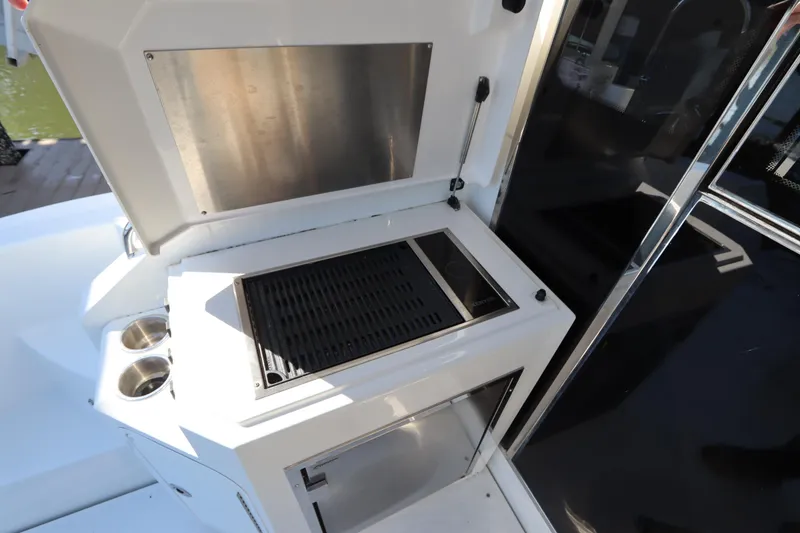 Slide: The Image of Grill area on a 2015 Cruisers Yachts 45 Cantius. - 26