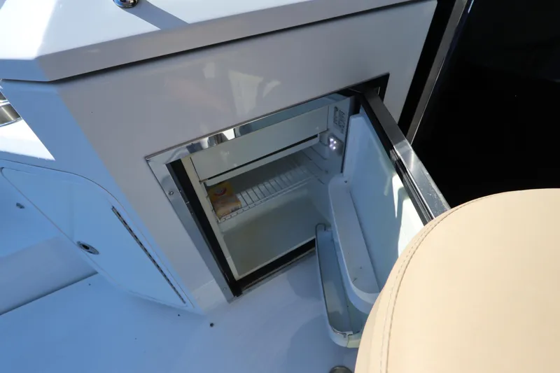 Slide: The Image of Open refrigerator on a 2015 Cruisers Yachts 45 Cantius. - 27