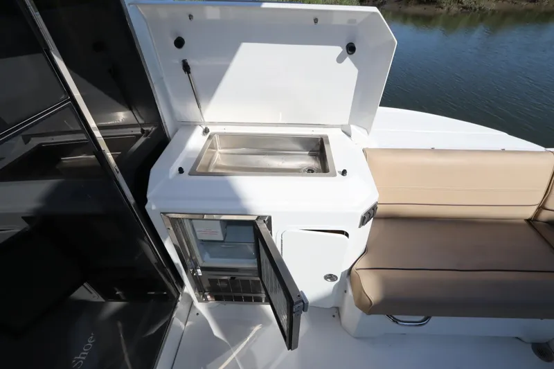 Slide: The Image of Interior of 2015 Cruisers Yachts 45 Cantius with seating and fridge. - 29