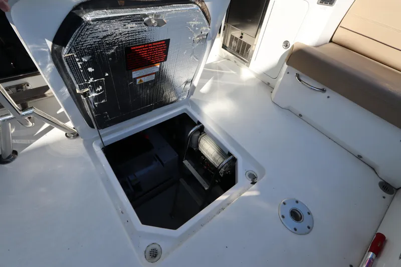 Slide: The Image of Engine compartment of 2015 Cruisers Yachts 45 Cantius with open hatch. - 30