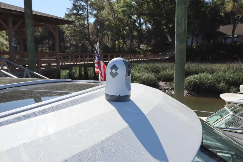 Slide: The Image of 2015 Cruisers Yachts 45 Cantius with camera on roof, docked at harbor. - 36