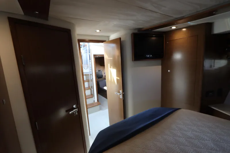 Slide: The Image of Interior of 2015 Cruisers Yachts 45 Cantius with bedroom and stairs. - 4
