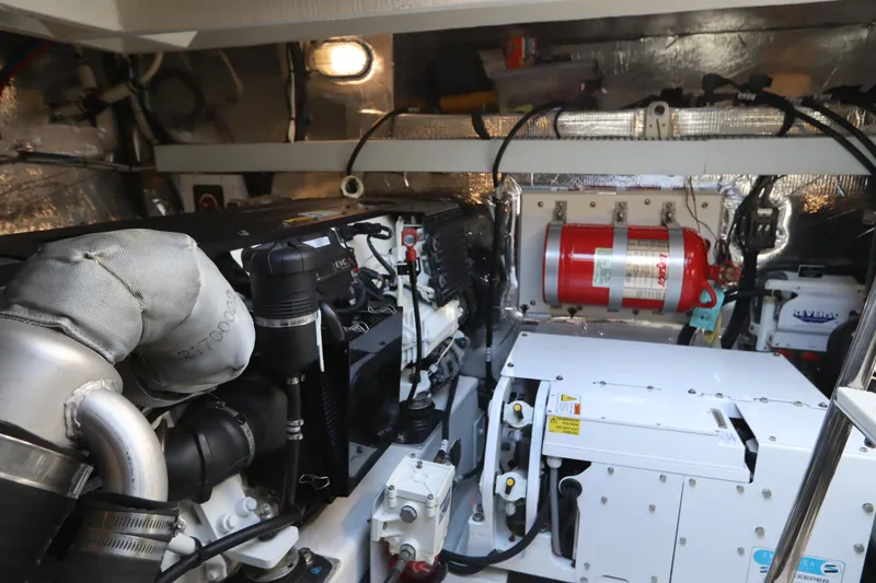 Slide: The Image of Engine room of 2015 Cruisers Yachts 45 Cantius with fire extinguisher. - 40
