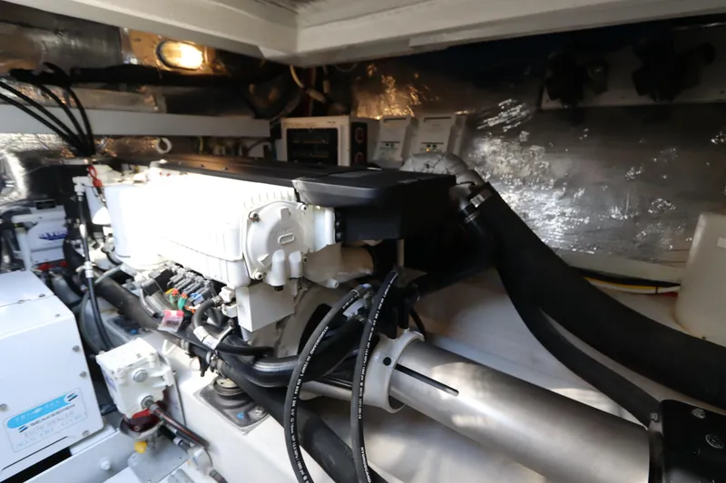 Slide: The Image of Engine room of 2015 Cruisers Yachts 45 Cantius with technical details. - 42