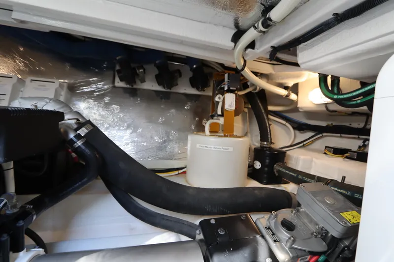 Slide: The Image of Engine room of 2015 Cruisers Yachts 45 Cantius, showcasing technical details. - 43