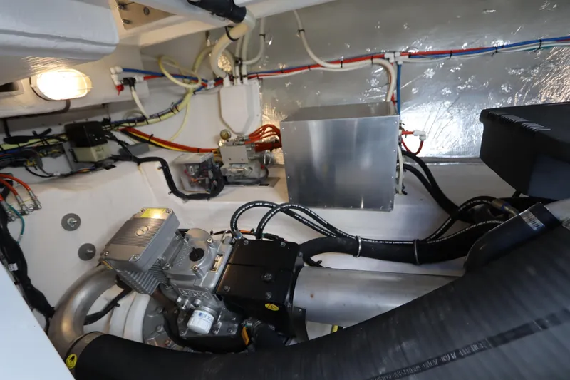 Slide: The Image of Engine room of 2015 Cruisers Yachts 45 Cantius with wiring and machinery. - 45