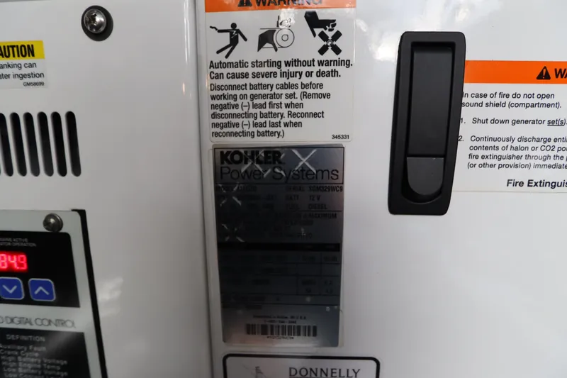 Slide: The Image of Kohler Power Systems warning labels on 2015 Cruisers Yachts 45 Cantius. - 46